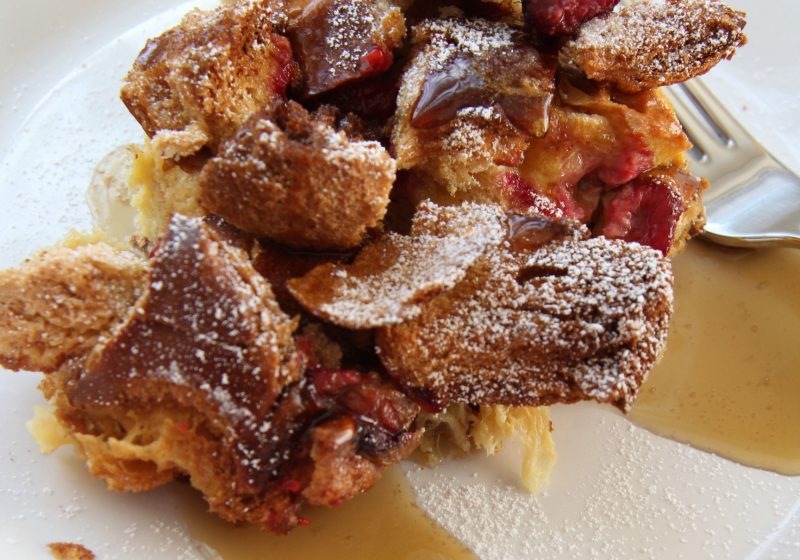 Want a guest worthy brunch recipe? This Raspberry Baked French Bread pudding has a crusty top, soft middle and sweet of berries.. it is divine!