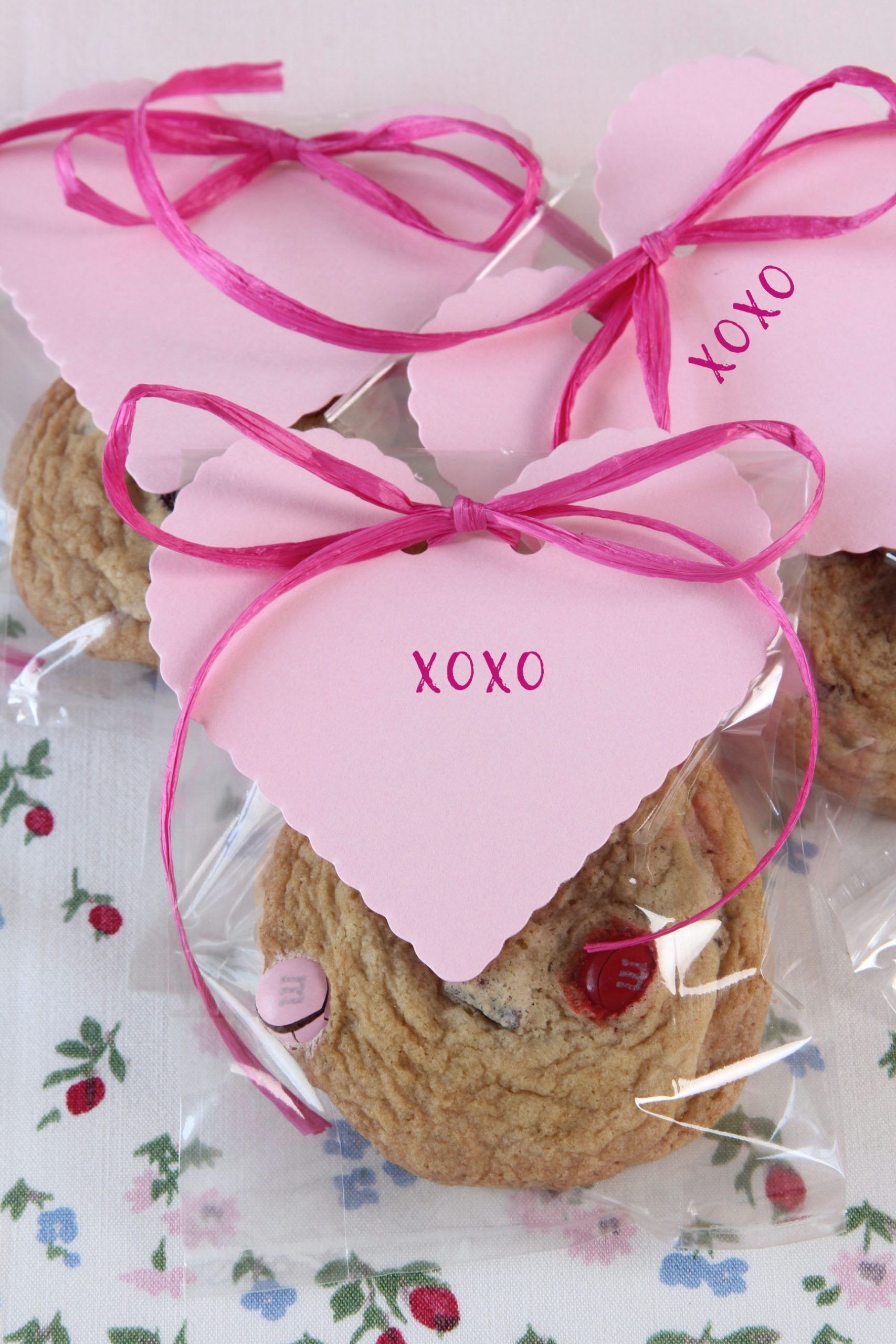 Make these swoon worthy Chocolate Chunk Cookies with Valentine colored M&M'S® and dried cherries for a Valentine's Treat! One is not enough!