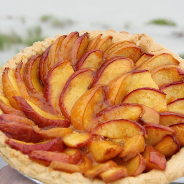 Fresh peaches, a hint of homemade almond paste and a flakey crust make this rustic tart a winner! The best dessert, with the taste of Summer in every bite!