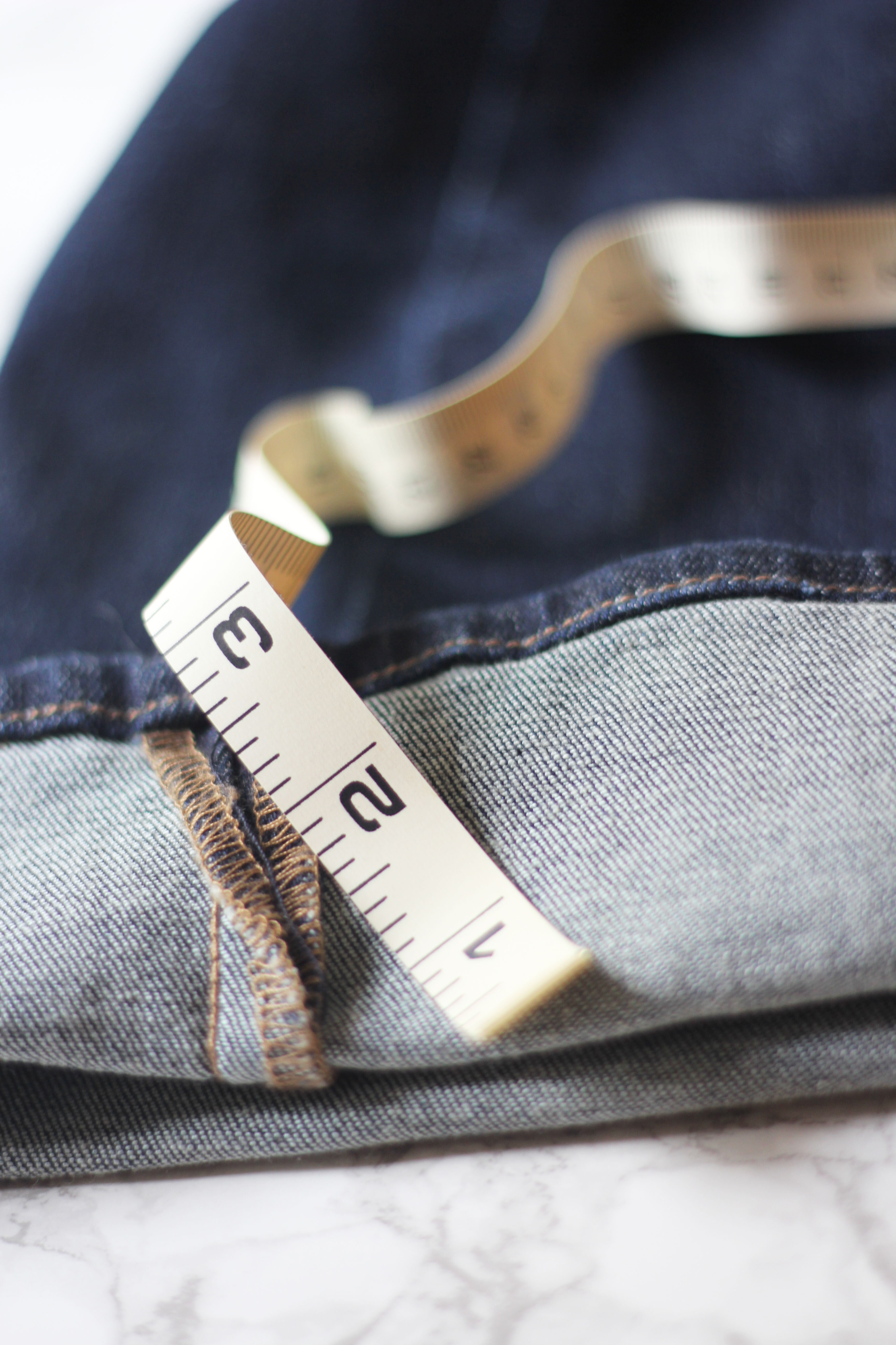 Why pay a fortune for Frayed jeans? When you can do it yourself! Step One.. Get out your measuring tape and mark the proper length.