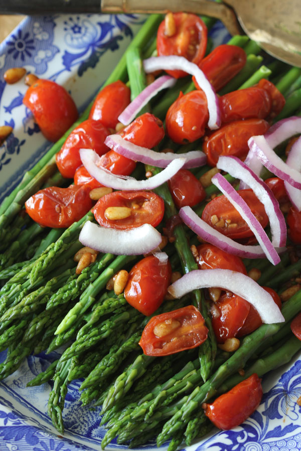 Looking for a healthy, delicious side dish Ridgely Brode makes Asparagus with Balsamic Tomatoes and Pine Nuts on her blog Ridgely's Radar.