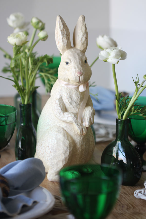 Ridgely Brode creates a simple and rustic green and white table for Easter on her blog, Ridgely's Radar.