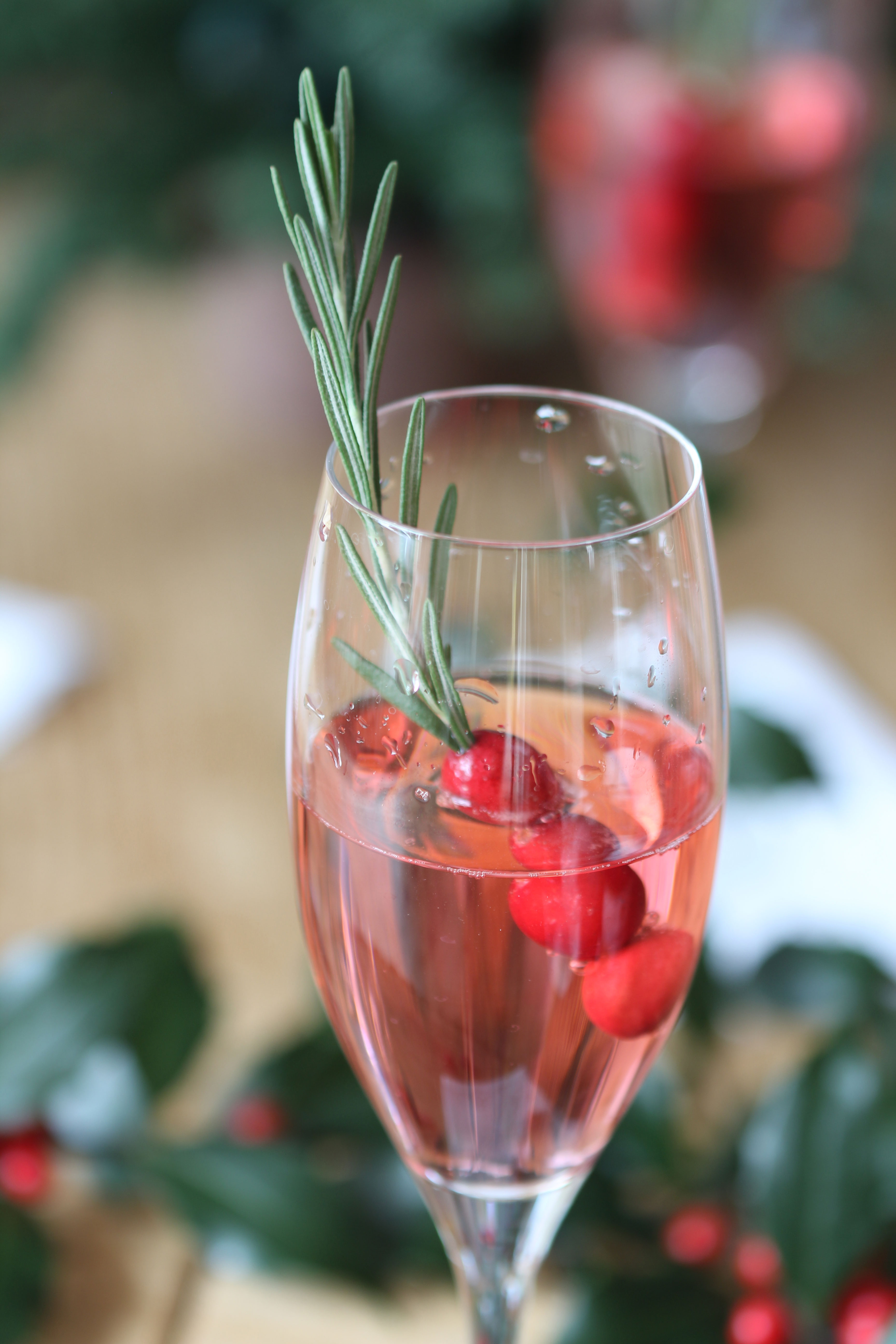Celebrate the season with this festive and delicious Cranberry Rosemary Champagne Cocktail that will WOW your guests!