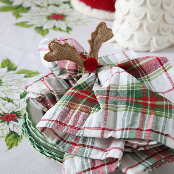 Mixing and matching your plaid, tartan and holiday linens at Christmas is a fun and festive way to decorate your table.