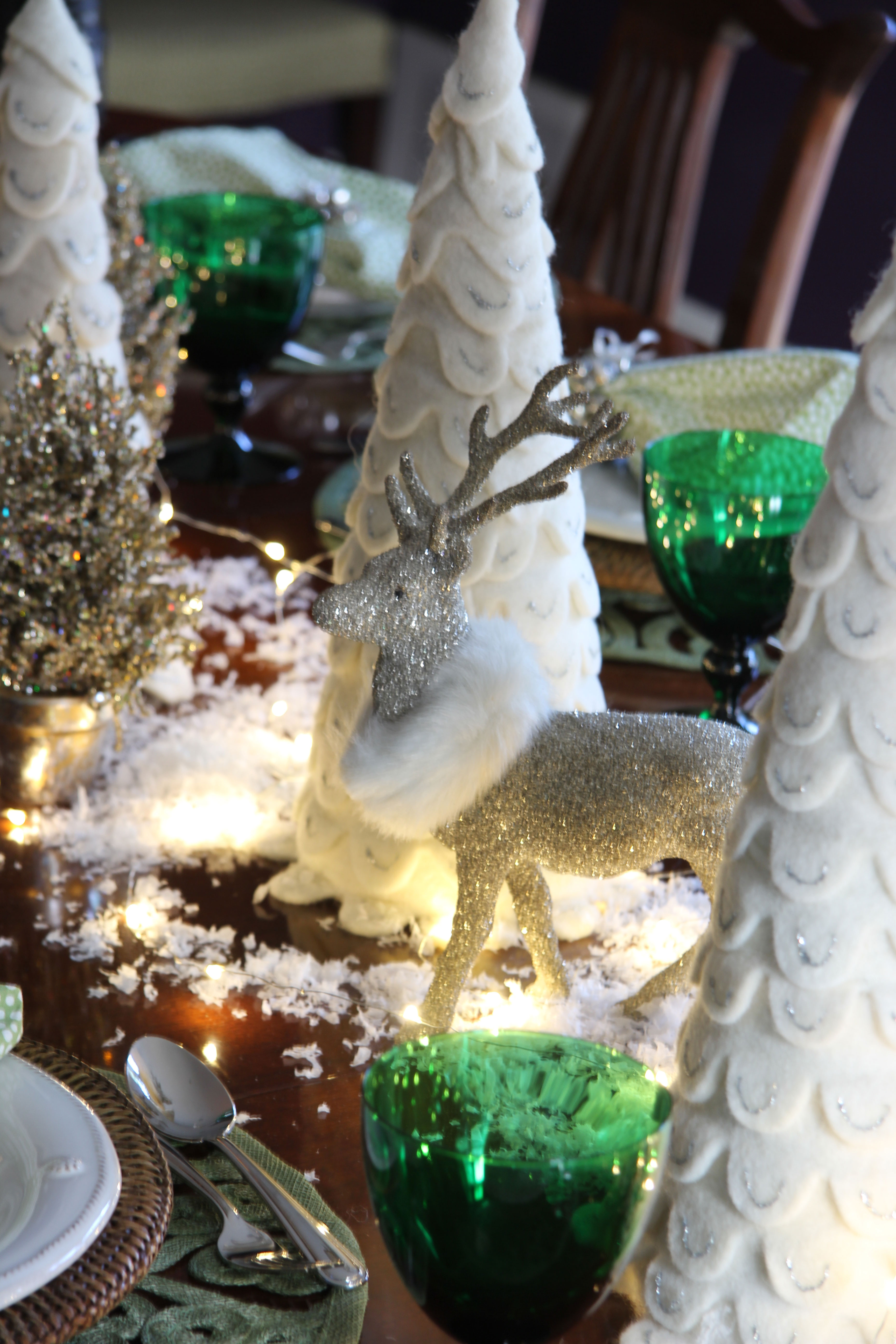 See how to create a magical snowy table for your Christmas gatherings. Don't forget the sparkly reindeer, faux snow and fairy lights!