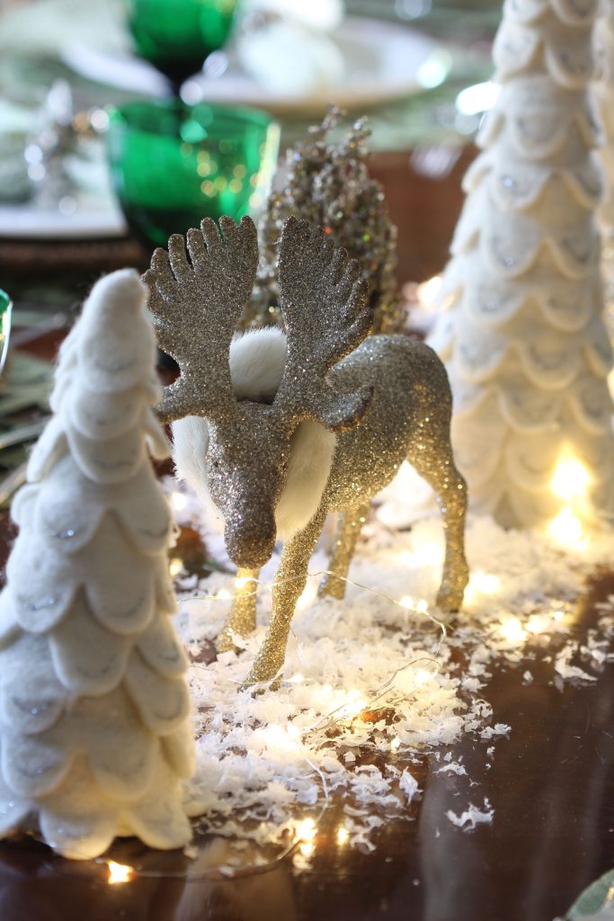 See how to create a magical snowy table for your Christmas gatherings. Don't forget the sparkly reindeer, faux snow and fairy lights!
