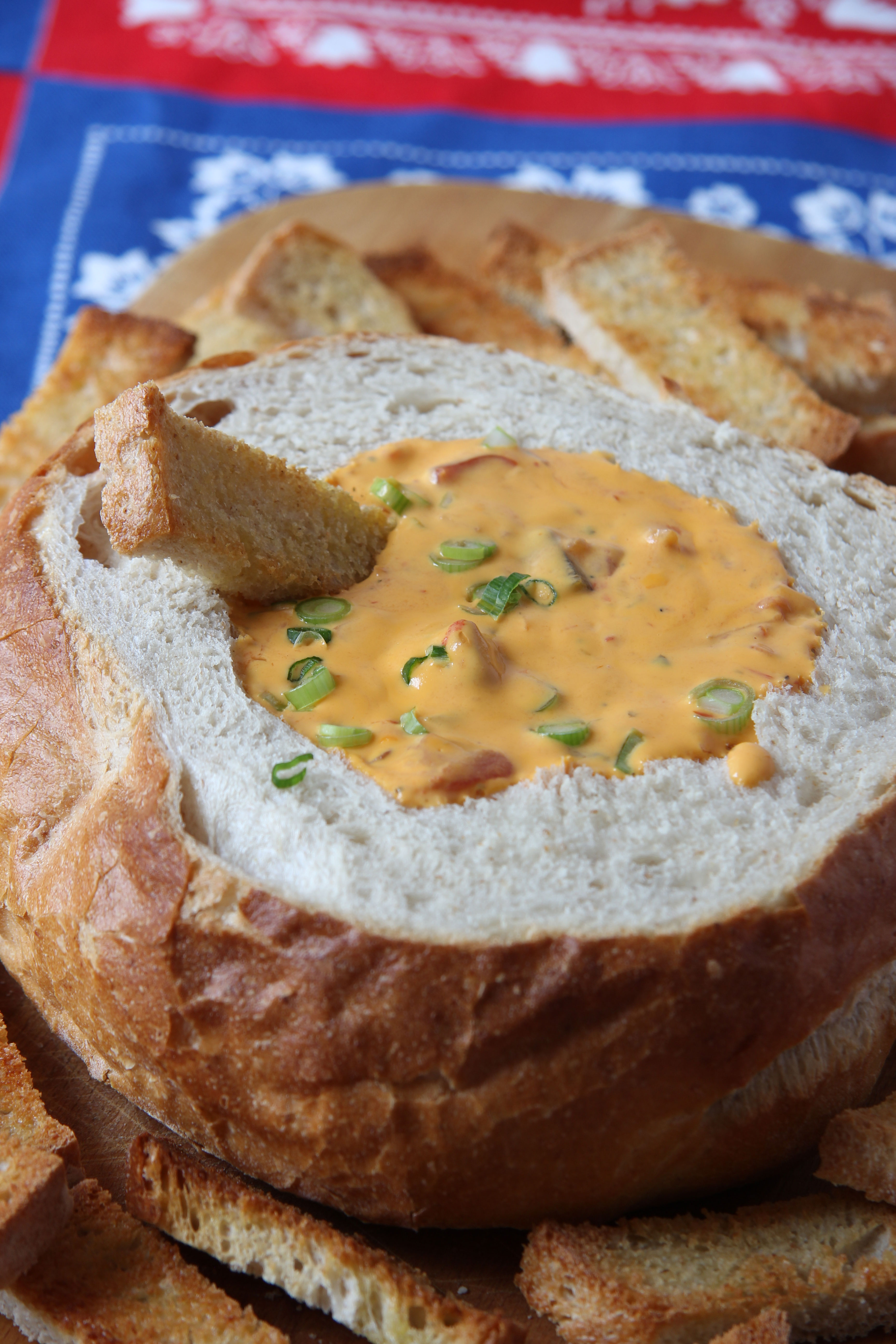 Make this gooey, cheesy nacho dip that features RAGU Double Cheddar Cheese Sauce. Put it in a scooped out bread bowl and dip with toasted bread fingers!