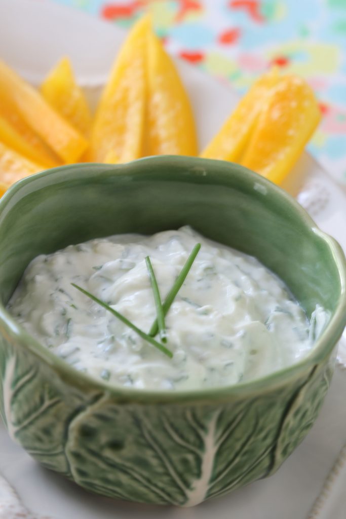 Lifestyle Blogger, Ridgely Brode srrves up a relatively healthy roasted garlic and chive dip with sliced yellow peppers on her blog.