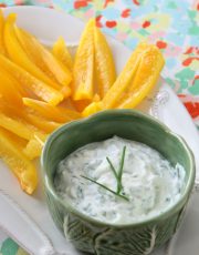 Lifestyle Blogger, Ridgely Brode srrves up a relatively healthy roasted garlic and chive dip with sliced yellow peppers on her blog.