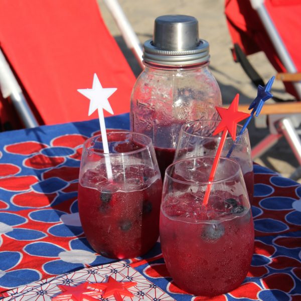 Serve up these fun Spiked Blueberry Limeade cocktails that taste delicious - looks festive and will quickly disappear! And they are the perfect colors for any patriotic theme!