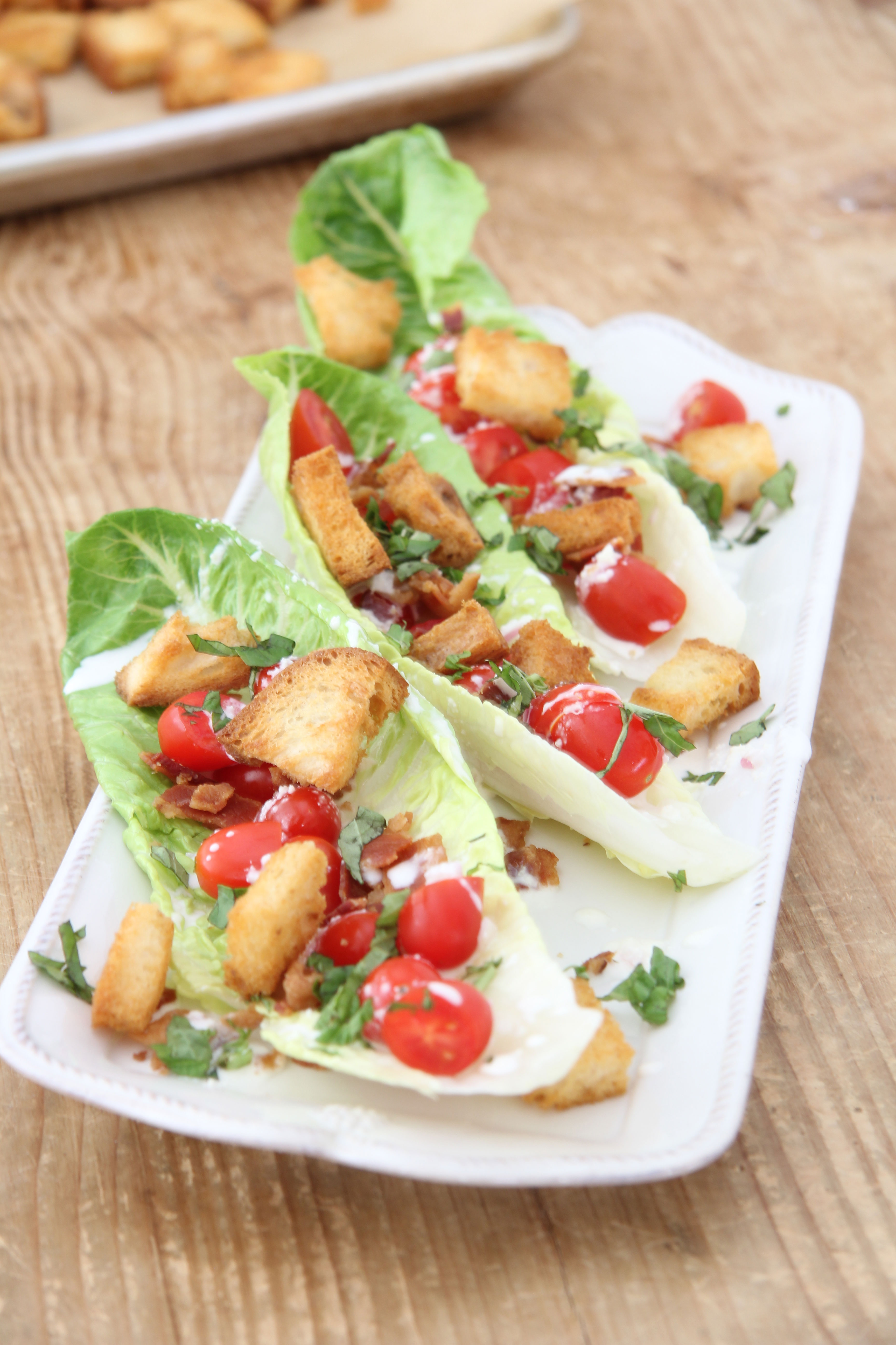 Love a BLT Sandwich? This BLT Salad with Buttermilk-Parmesan Dressing and Buttery Croutons is the next best thing.. maybe even better! YUM!