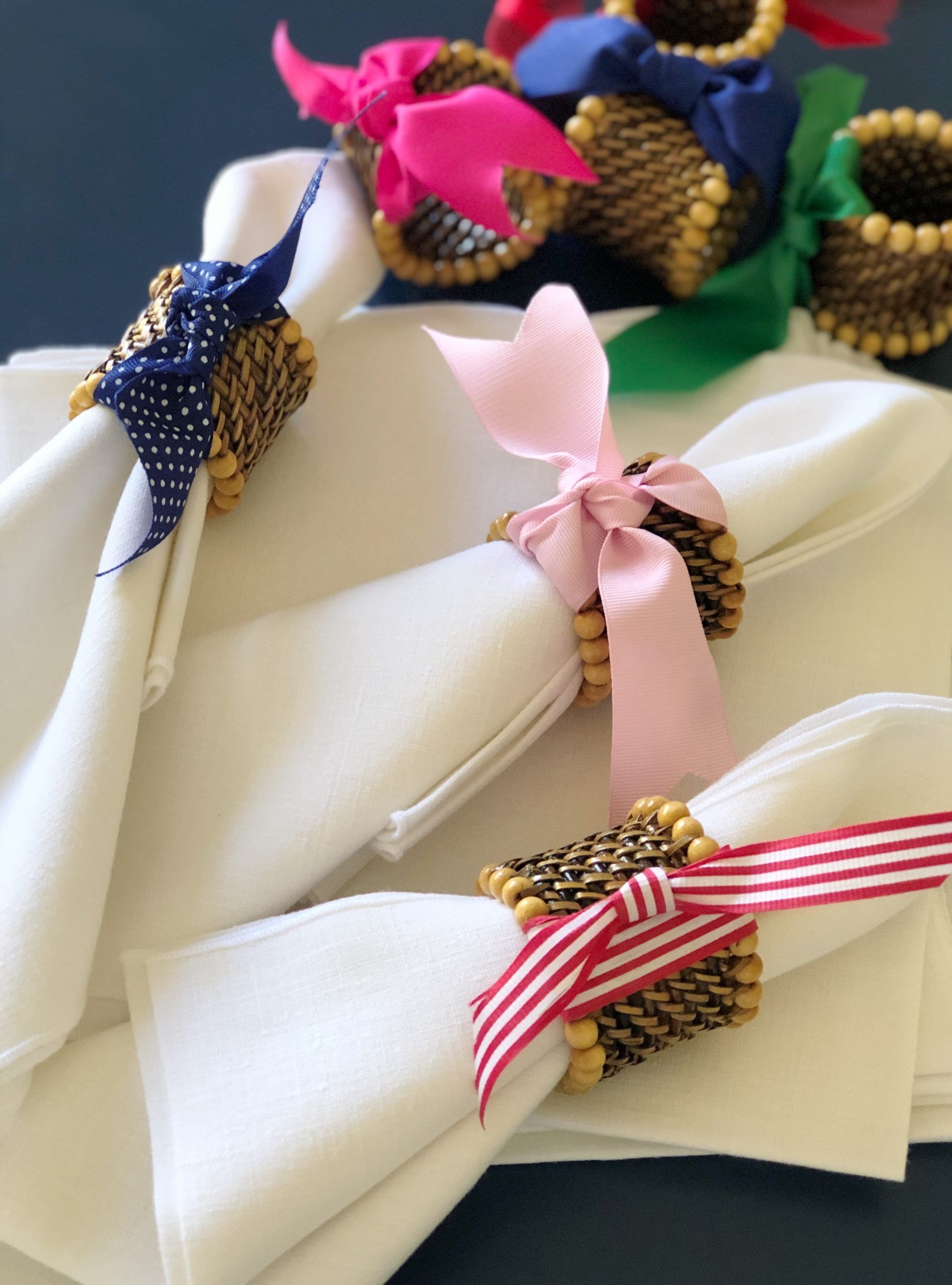 Save the wash! Tie different color ribbons onto your napkin rings and designate whose napkin is whose.
