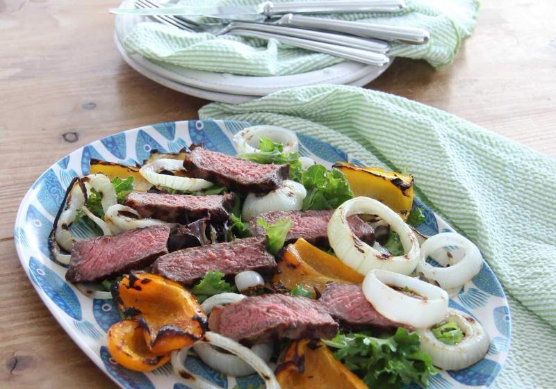 There is nothing better than a really good steak cooked on the grill! Add in some onions and peppers and make this yummy salad!