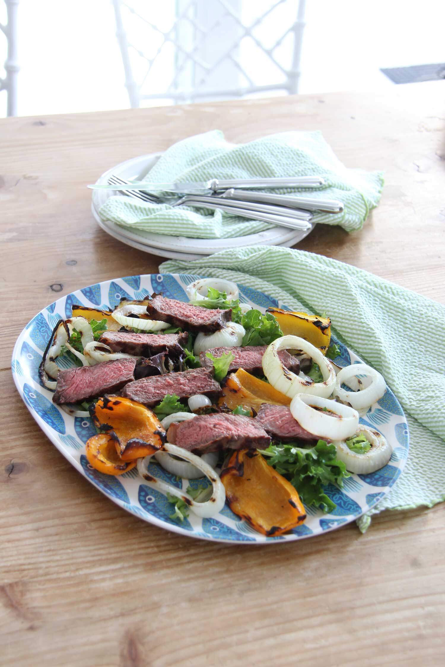 There is nothing better than a really good steak cooked on the grill! Add in some onions and peppers and make this yummy salad!
