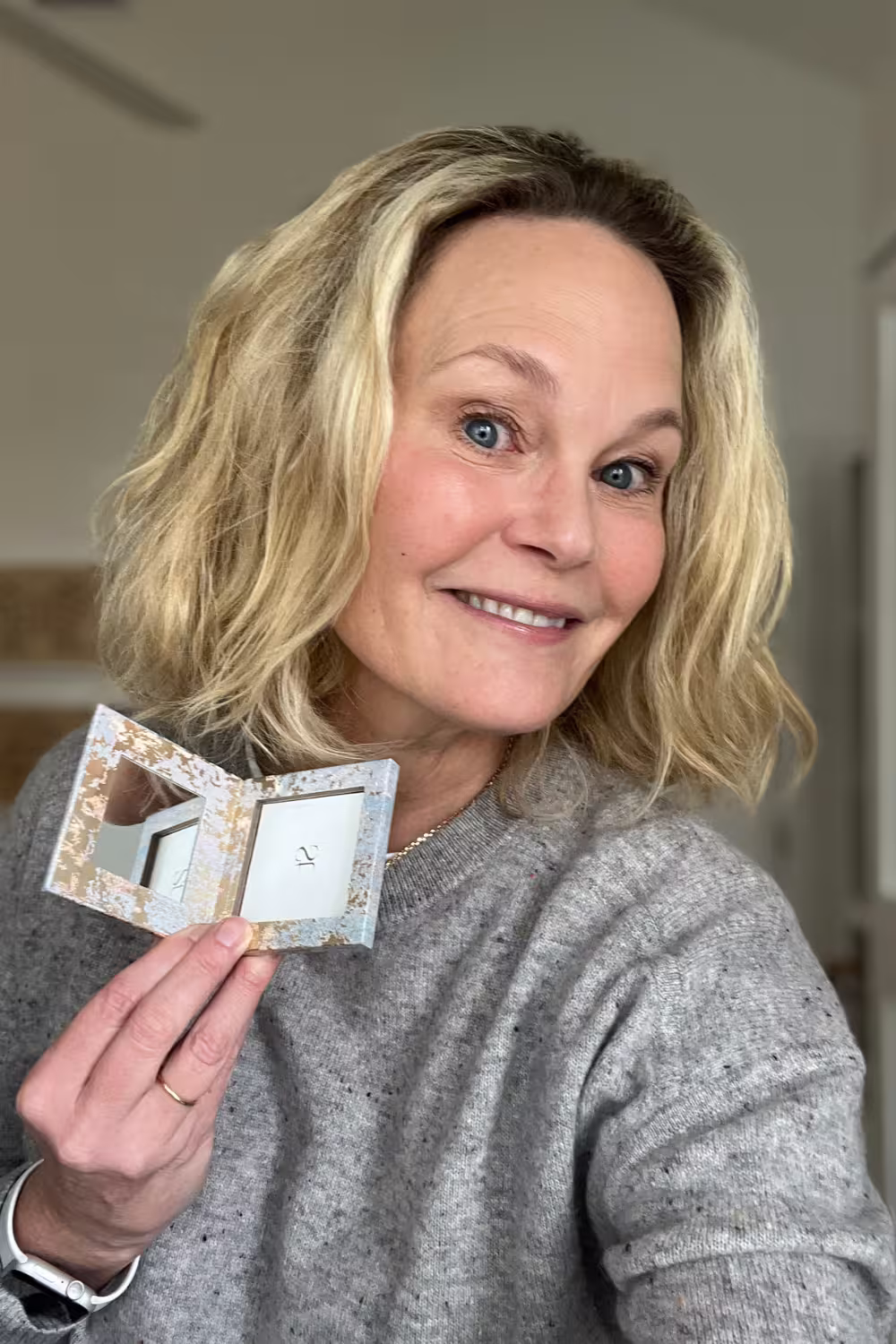 Ridgely holds the Seint Beauty square palette, perfect for 4 eyeshadows or 2 makeup tins.